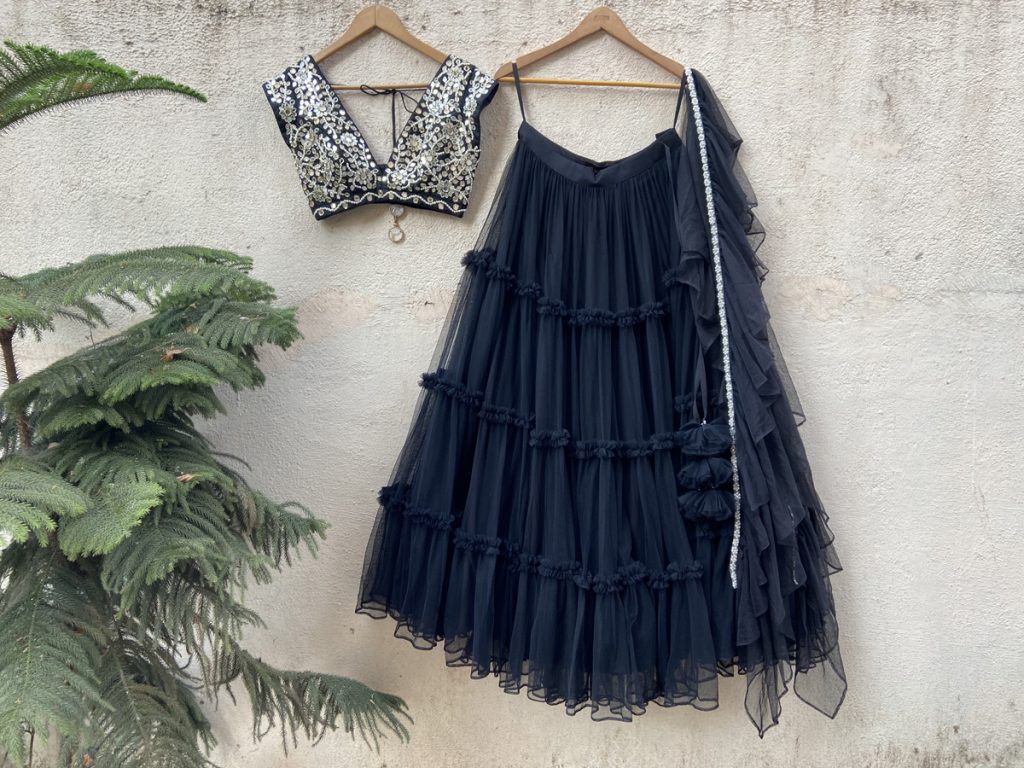 Black Tier Skirt With Black Raw Silk Mirror Work Blouse - Designer Brand Priti Sahni - London England United Kingdom - Black Thread Co - 1